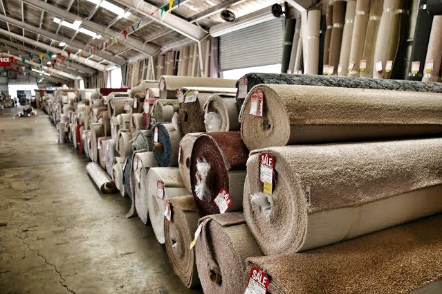 Numerous rolls of various carpets available at The Carpet Store Tampa, FL warehouse