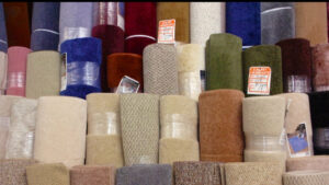 Various rolls of carpet remnants displayed for sale at Craft Rug Mills in Easton, PA.