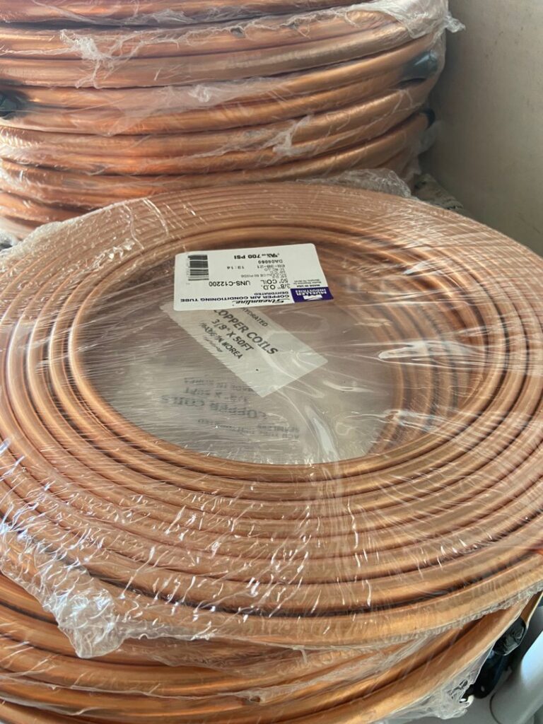 Rolls of new copper coils and air conditioning tubing, essential for HVAC installations, at SURPLUS AC INC. in Doral, FL