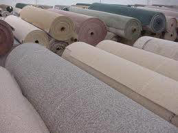 Rolls of various colored carpet ready for installation at My Affordable Floors Inc. in Kenosha, WI.