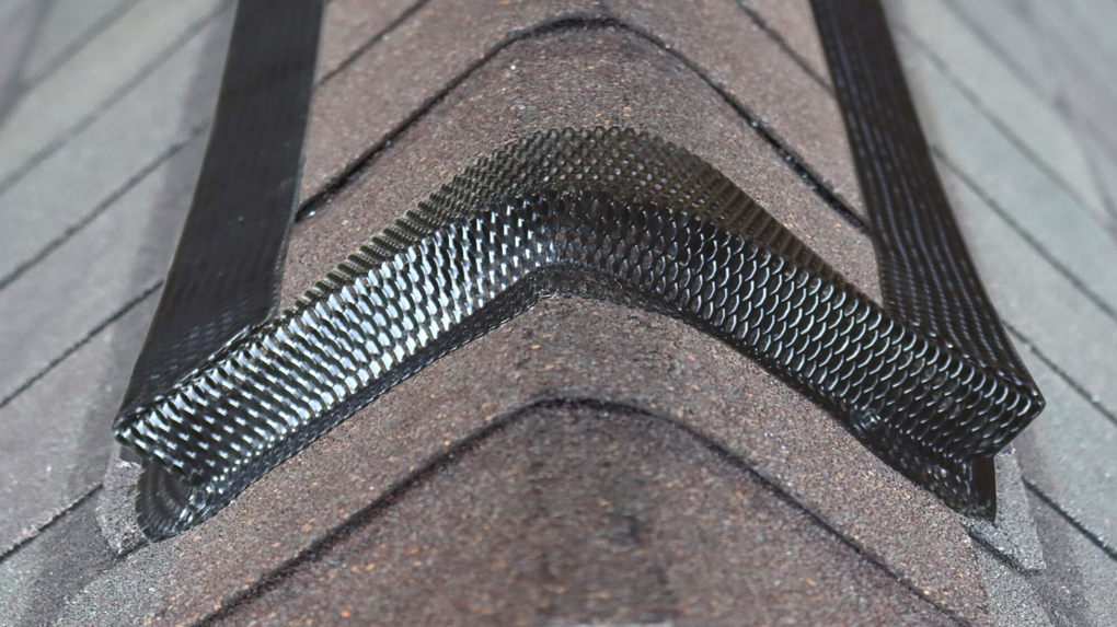 Roof ridge critter guard installation by Animal Management Systems Inc in Noblesville, IN, preventing wildlife entry.