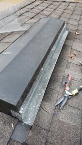 A roof vent being sealed with wire mesh to prevent wildlife entry, a professional exclusion service by Varmint Eviction Wildlife Removal Services in Tallahassee, FL.