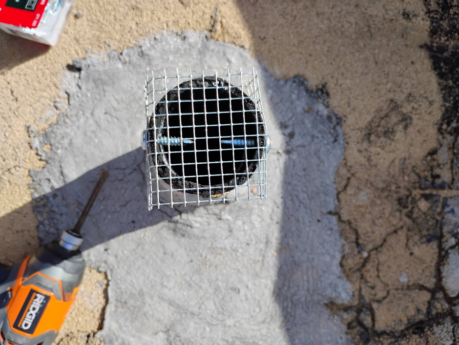 A metal mesh screen installed on a roof vent for wildlife exclusion by Pestpuncherspcs in Rio Rancho, NM.