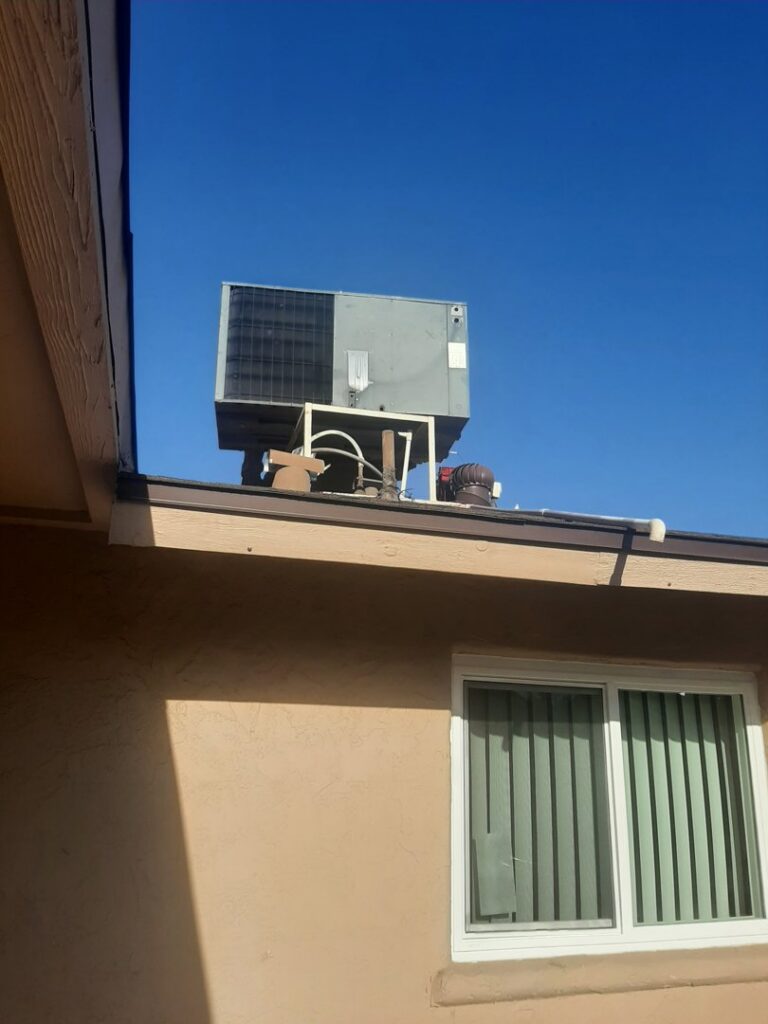 A rooftop AC unit installed on a residential building, serviced by Alien Air Conditioning and Heating in Phoenix, AZ.