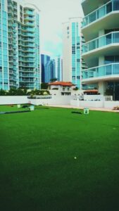 Rooftop artificial turf installation in progress by Global Flooring Enterprise in Miami, FL.