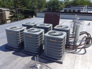 Multiple Ducane commercial rooftop air conditioning units installed by Adam's HVAC in Naperville, IL.