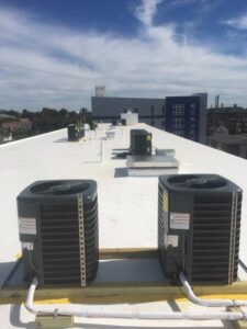 Multiple rooftop commercial air conditioning units installed by Michael Savage-Lanz Heating & Cooling in Champaign, IL