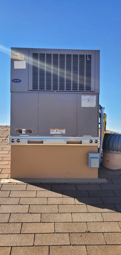 A tall commercial HVAC unit installed on a rooftop by Anderson Refrigeration, Inc. in Poplar Grove, IL.