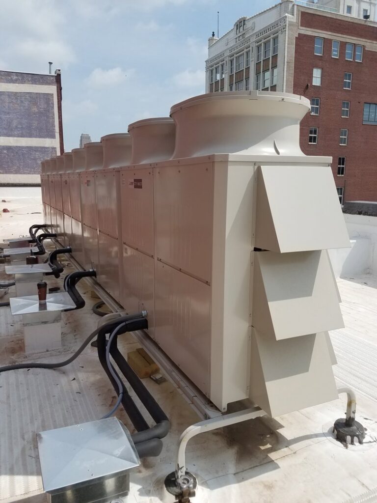 Rooftop commercial HVAC systems installed by Polar Aire Heating & Cooling on a building in Olathe, KS
