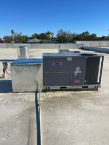 A rooftop commercial HVAC system with ductwork on a sunny day by Wicked Cool HVAC in Charleston, SC.