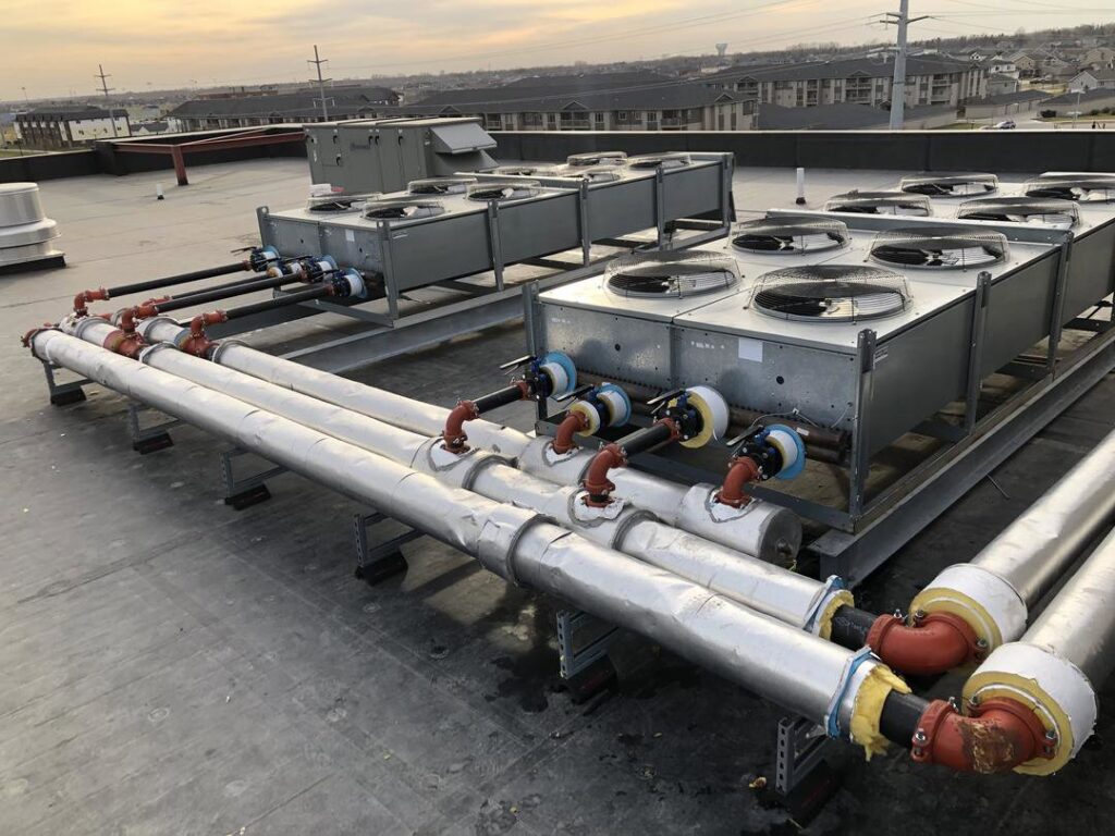 Rooftop commercial HVAC units with insulated piping installed by Precision Heating & Air Conditioning in Royersford, PA