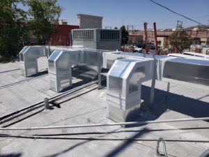Rooftop ductwork installation on a commercial building by Dynamic Heating, Cooling, Refrigeration & Roofing in El Paso, TX.