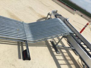 Rooftop electrical conduit installation connecting to a cable tray by New Revelation Technologies LLC in Nampa, ID.