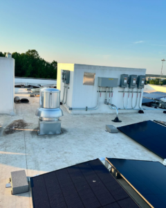 Rooftop electrical panels, conduits, and solar installation by Revamp Electric LLC in Columbus, OH.