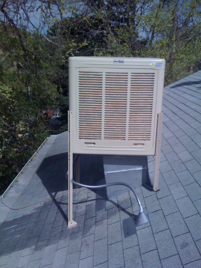 An evaporative cooler unit installed on a residential rooftop by Geddes Heating and Cooling in Aurora, CO.