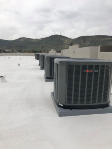 Multiple Trane HVAC condenser units installed on a commercial rooftop by B3 Refrigeration LLC in Tempe, AZ