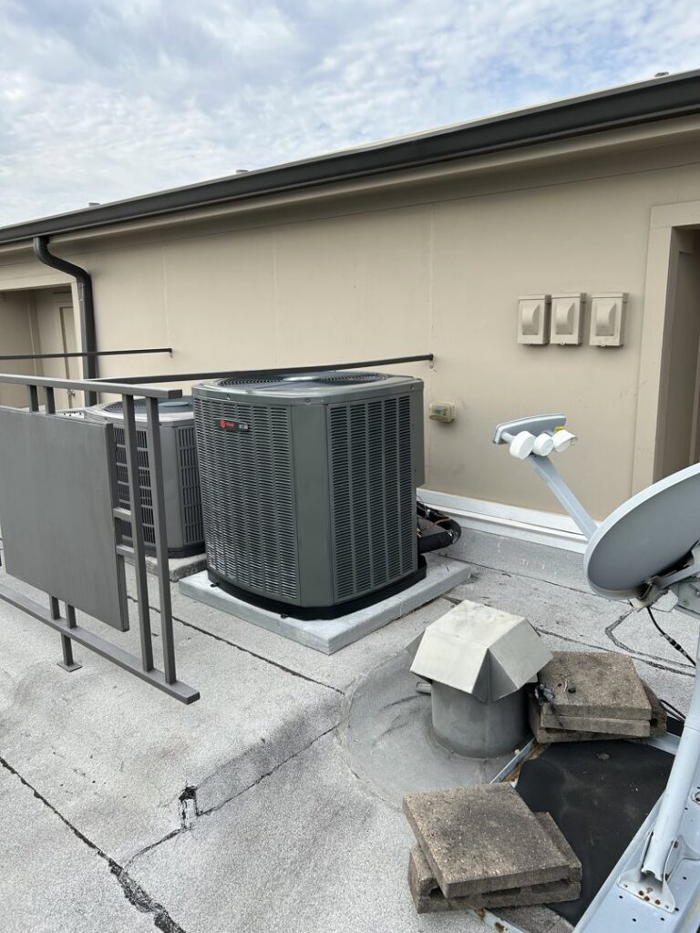 Two rooftop HVAC condenser units installed on a commercial building by Tek-Aire Services Inc. in Columbia, SC.