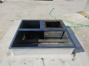 Rooftop HVAC curb with duct connections ready for unit placement by Acclimated Air LLC in Virginia Beach, VA.