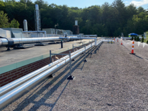 Rooftop view of insulated HVAC pipes and ducts, showcasing work by North Country Mechanical Insulators in South Burlington, VT.