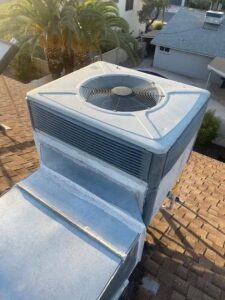 A rooftop HVAC package unit with visible ductwork, installed by Ault's Cooling HVAC Services LLC in Chandler, AZ.
