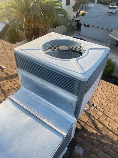 A rooftop HVAC package unit with visible ductwork, installed by Ault's Cooling HVAC Services LLC in Chandler, AZ.