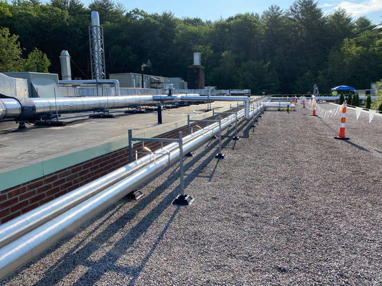 Rooftop view of insulated HVAC piping and ductwork installed by North Country Mechanical Insulators in South Burlington, VT.