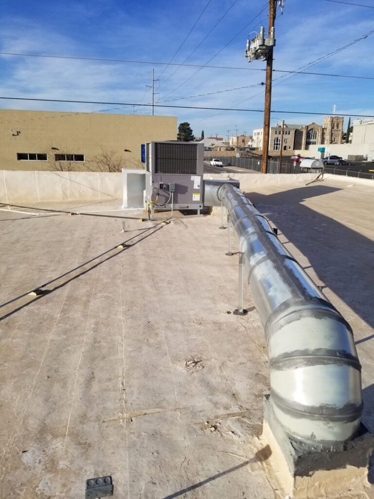 A newly installed rooftop HVAC unit with extensive ductwork by One Way Heating And Cooling, LLC in Horizon City, TX.