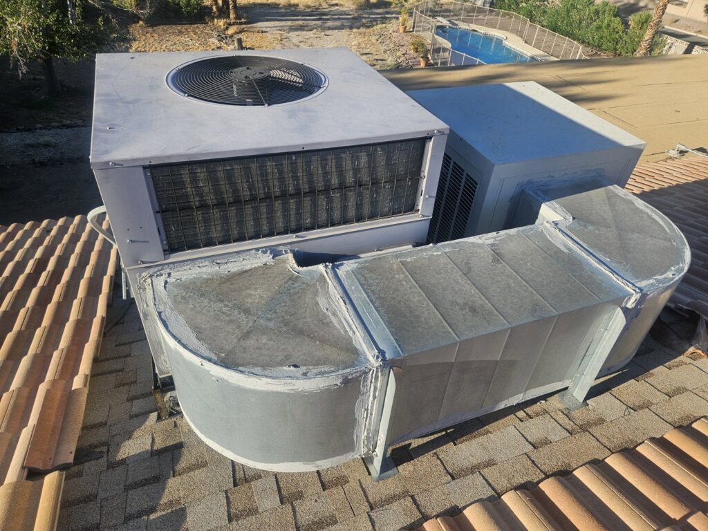 A rooftop HVAC unit with connected ductwork installed on a tiled roof by Colton Air Conditioning - Las Vegas in Las Vegas, NV.