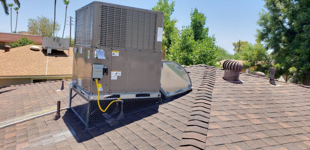 A newly installed rooftop HVAC unit on a residential home by Brisk Air Inc in Phoenix, AZ.