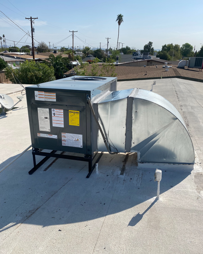 A newly installed rooftop HVAC unit with ductwork, serviced by Kings of AC, LLC in Queen Creek, AZ.