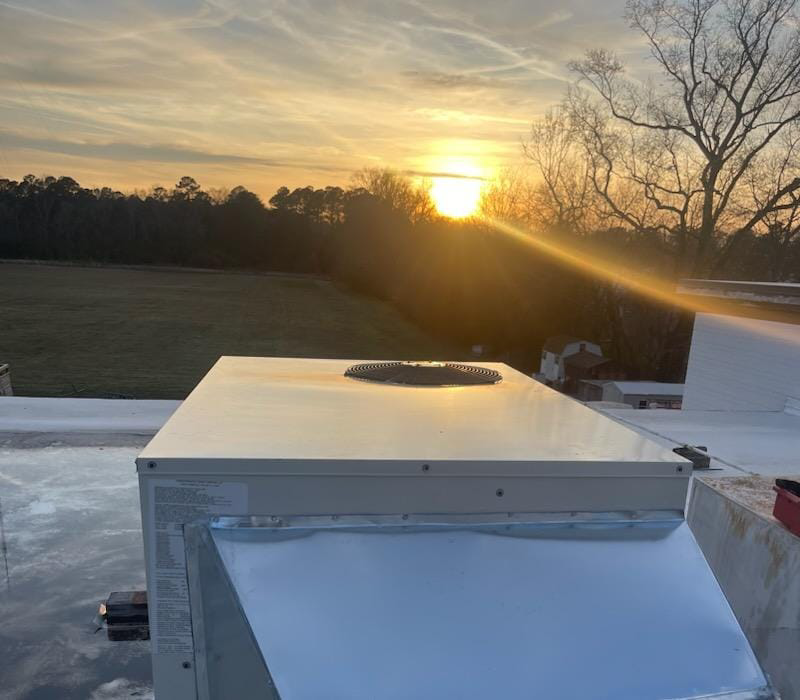A commercial rooftop HVAC unit installation by Mike Wells Services in Suffolk, VA.