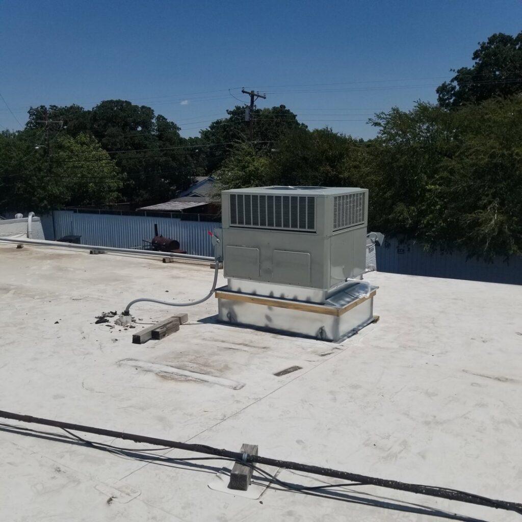 A newly installed rooftop HVAC unit on a commercial building by Modern Air Services in Fort Worth, TX.