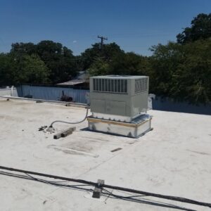 A newly installed rooftop HVAC unit on a commercial building by Modern Air Services in Fort Worth, TX.