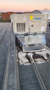 A newly installed Daikin rooftop HVAC unit on a commercial building by PNW Spokane Heating and Air in Spokane, WA.