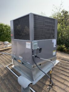 A newly installed rooftop HVAC unit on a residential building, showcasing services from Valle Del Sol Home Services, LLC in Scottsdale, AZ.