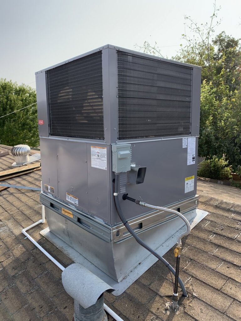 A newly installed rooftop HVAC unit on a residential building, showcasing services from Valle Del Sol Home Services, LLC in Scottsdale, AZ.