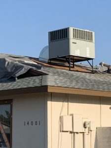 A rooftop HVAC unit installed on a residential house by Advanced Comfort A/C & Heating in Phoenix, AZ.