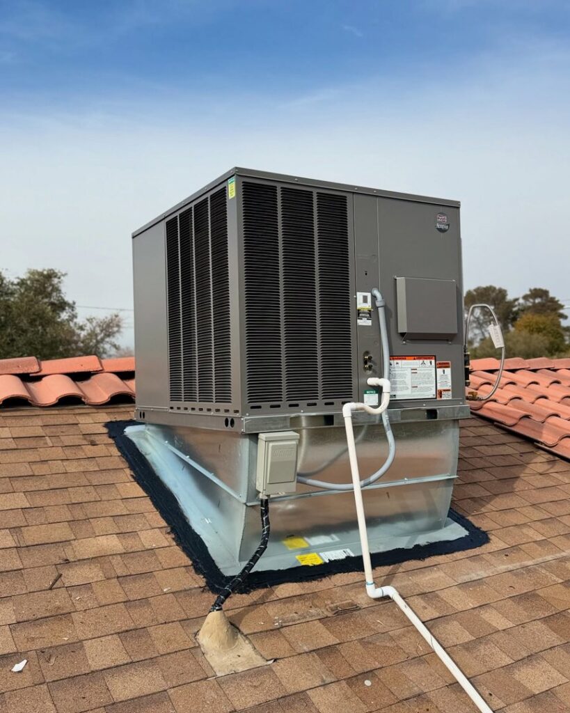 A new rooftop HVAC unit installed on a residential tiled roof by Cool Camel HVAC in Henderson, NV