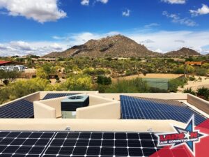 A rooftop HVAC unit installed alongside solar panels by Larson Air Conditioning in Scottsdale, AZ