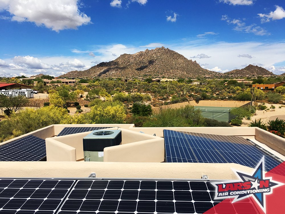 A rooftop HVAC unit installed alongside solar panels by Larson Air Conditioning in Scottsdale, AZ