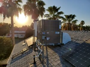 A rooftop HVAC unit at sunset, installed by All Pro Air, providing service in Warrenville, IL.