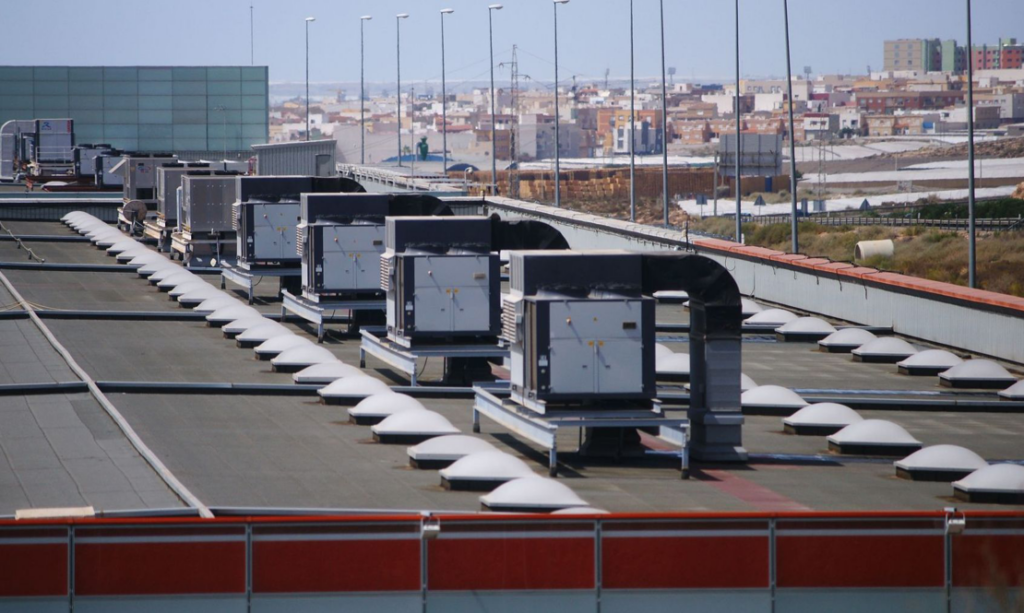 Commercial rooftop HVAC units on a building, serviced by Accurate HVAC in Vacaville, CA.