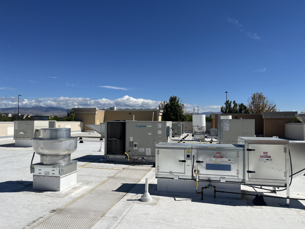 Multiple rooftop HVAC units on a commercial building, serviced by Atlas Heating and Air, LLC in Talent, OR