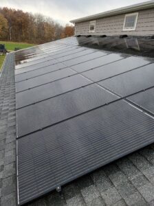 Rooftop solar panels installed on a residential building by All Circuit Electrical LLC, providing clean energy in Bryant, IN.