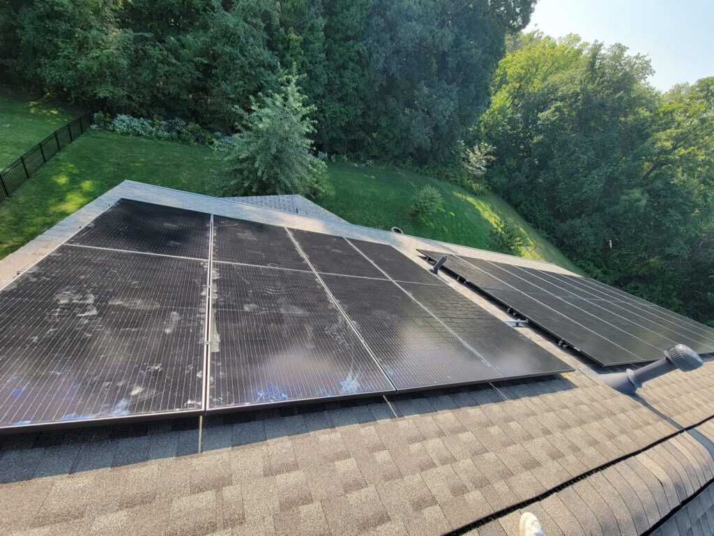 Rooftop solar panel installation on a residential home by Three Rivers Electric in Fort Wayne, IN.