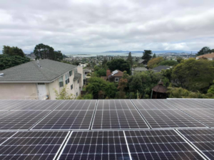 Rooftop solar panels with a scenic city and bay view installed by Element Power Systems, Inc. in Brentwood, CA