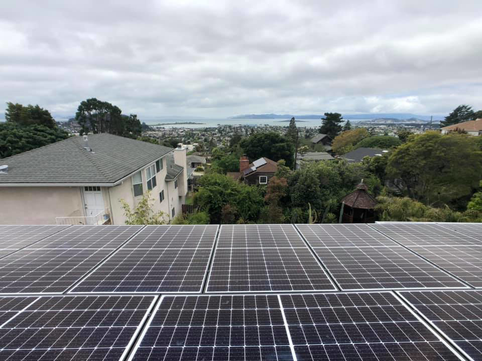 Rooftop solar panels with a scenic city and bay view installed by Element Power Systems, Inc. in Brentwood, CA