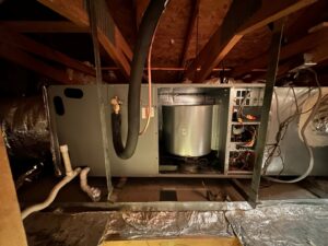 A rooftop York AC unit with exposed components during repair by McCutcheon & Sons Air Conditioning and Plumbing in Tempe, AZ