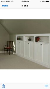 A room featuring built-in cabinets and new carpet flooring installed by US Renovations in Olive Branch, MS