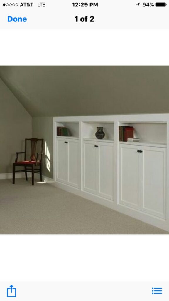 A room featuring built-in cabinets and new carpet flooring installed by US Renovations in Olive Branch, MS